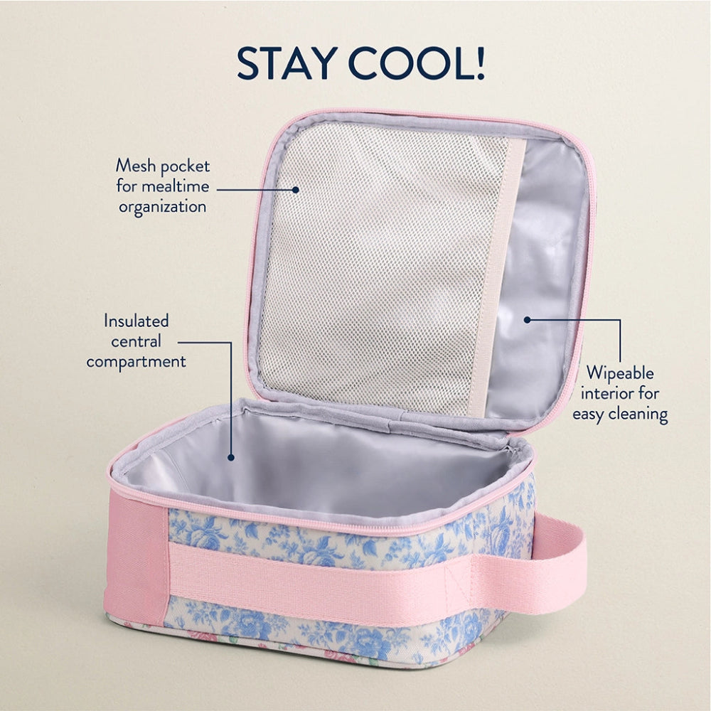 Itzy Ritzy Itzy Lunch Box Bag, pink strap on a blue floral shell opened to reveal insulated central compartment and wipeable interior.