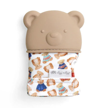 ITZY RITZY Itzy Ritzy Itzy Silicone Teething Mitts blue silicone teething mitt with whale motif worn over patterned fabric and textured for