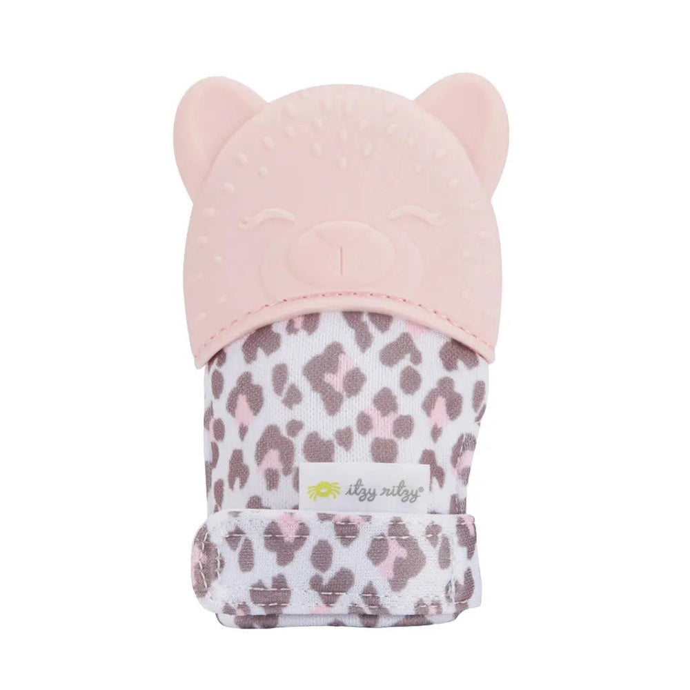 Itzy Ritzy Itzy Silicone Teething Mitts in pink bear cap and leopard-print fabric, worn on the hand to soothe gums.