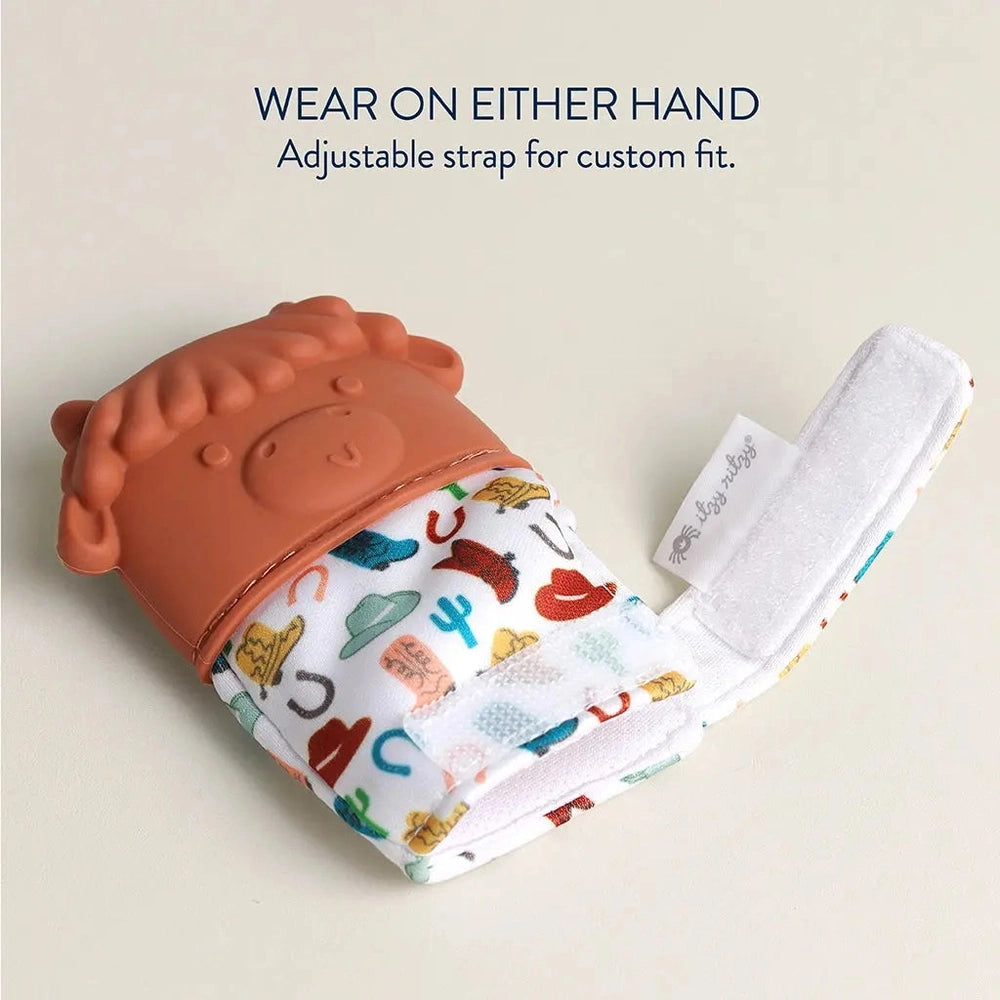 Itzy Ritzy Itzy Silicone Teething Mitts, peach silicone mitten with adjustable strap on a white fabric band with colorful print.