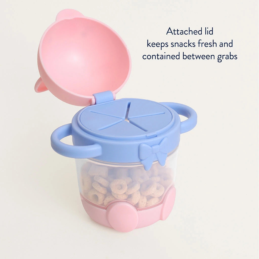 Itzy Ritzy Itzy Snack Pal Kitty cup with the attached character lid open above the snack-access opening.