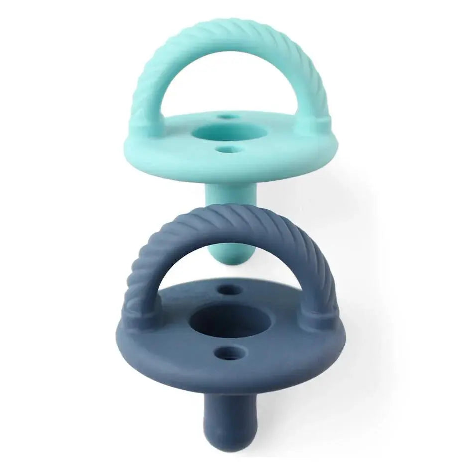 Itzy Ritzy Itzy Soother natural rubber pacifier set; two mint and navy pacifiers stacked together.