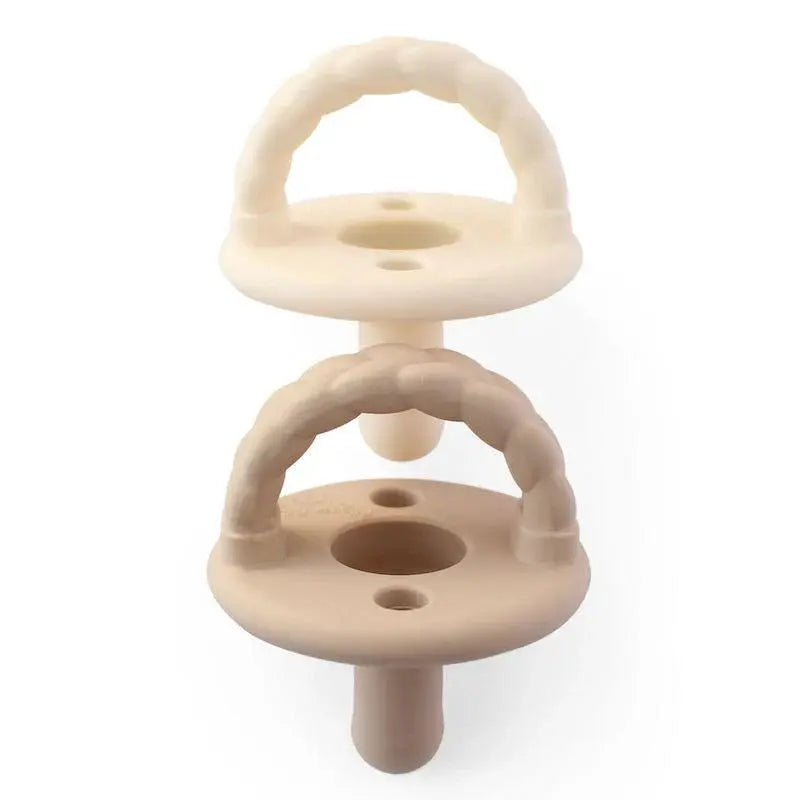 Itzy Ritzy Itzy Soother Natural Rubber Pacifier Sets (0-6M): two beige pacifiers with ring handles stacked.