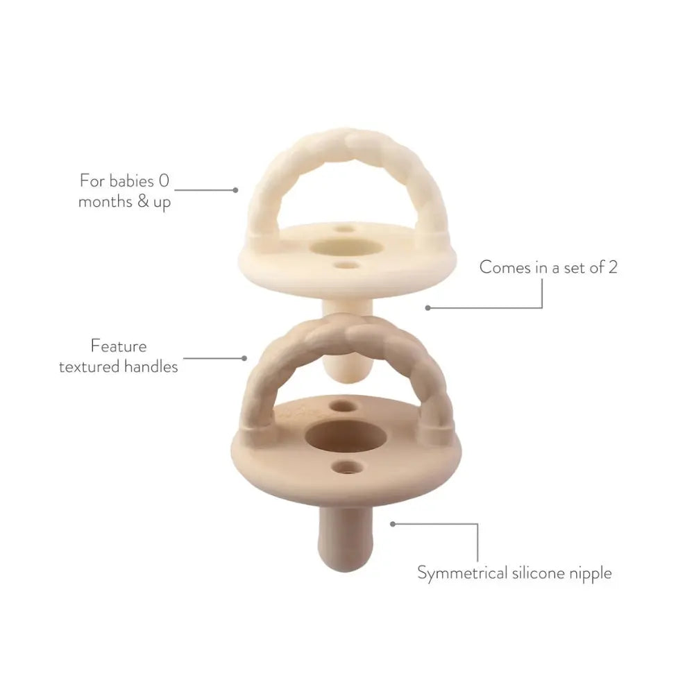 Itzy Ritzy Itzy Soother Natural Rubber Pacifier Sets (0-6M) two beige pacifiers with textured handles and symmetrical nipples