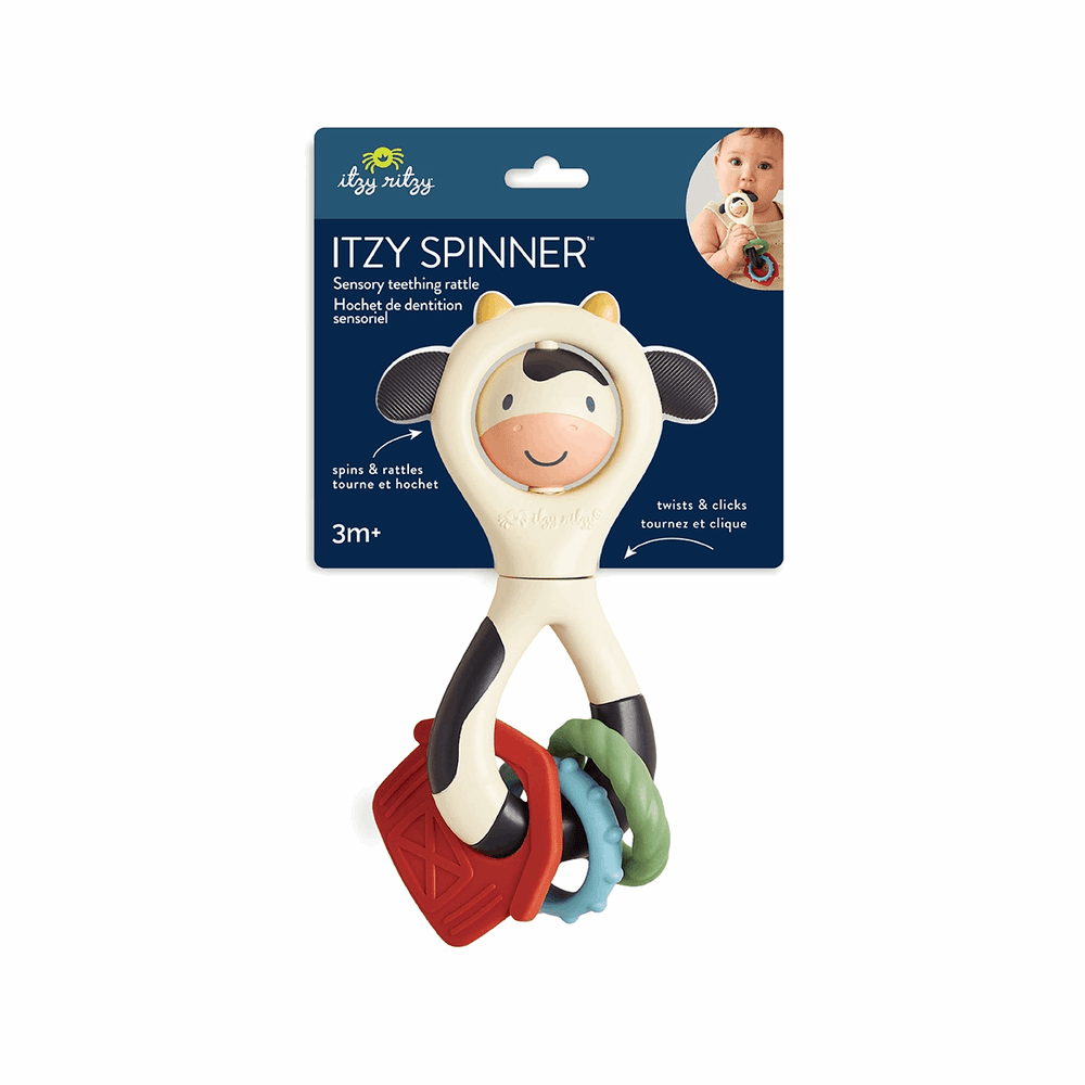 Itzy Ritzy Itzy Spinner teething toy with cow-face head and red, blue, green rings