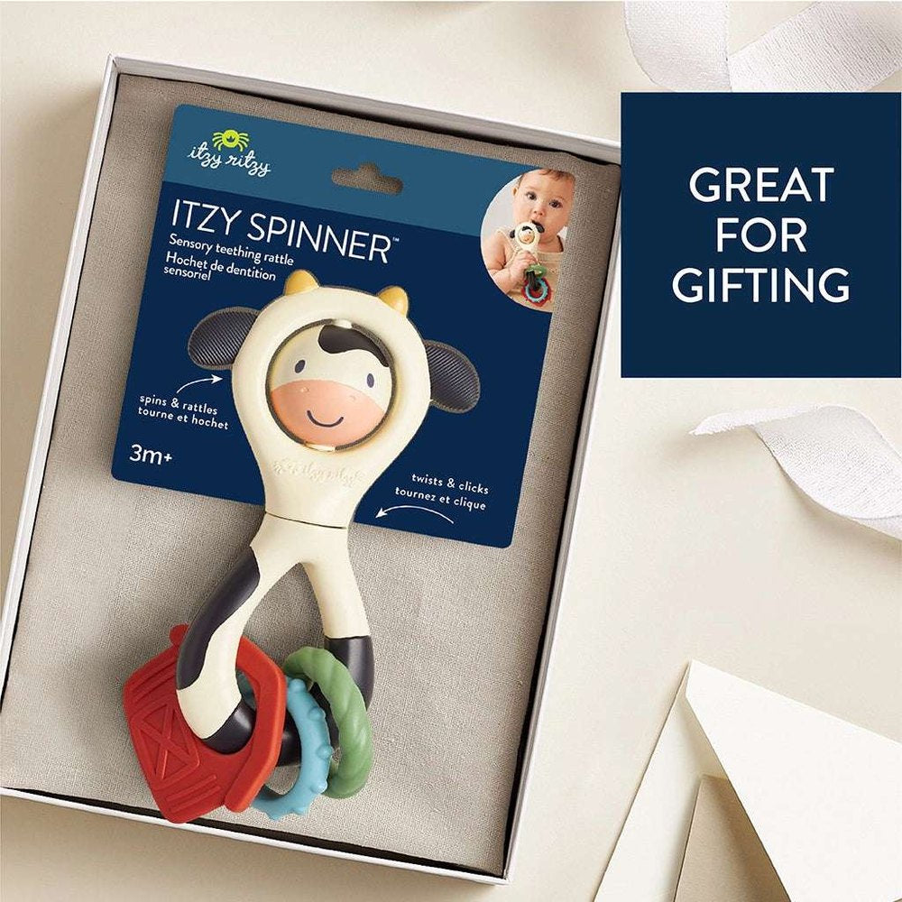 Itzy Ritzy Itzy Spinner teething toy in cream with red, blue and green rings in gift box
