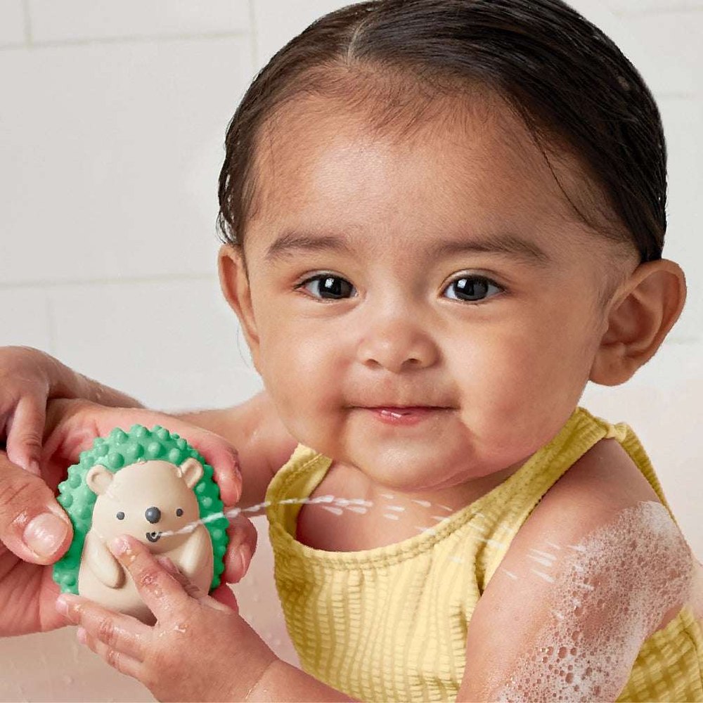 Itzy Ritzy Itzy Splash Bath Toys Gift Set; green hedgehog bath toy with smiling baby in yellow swimsuit