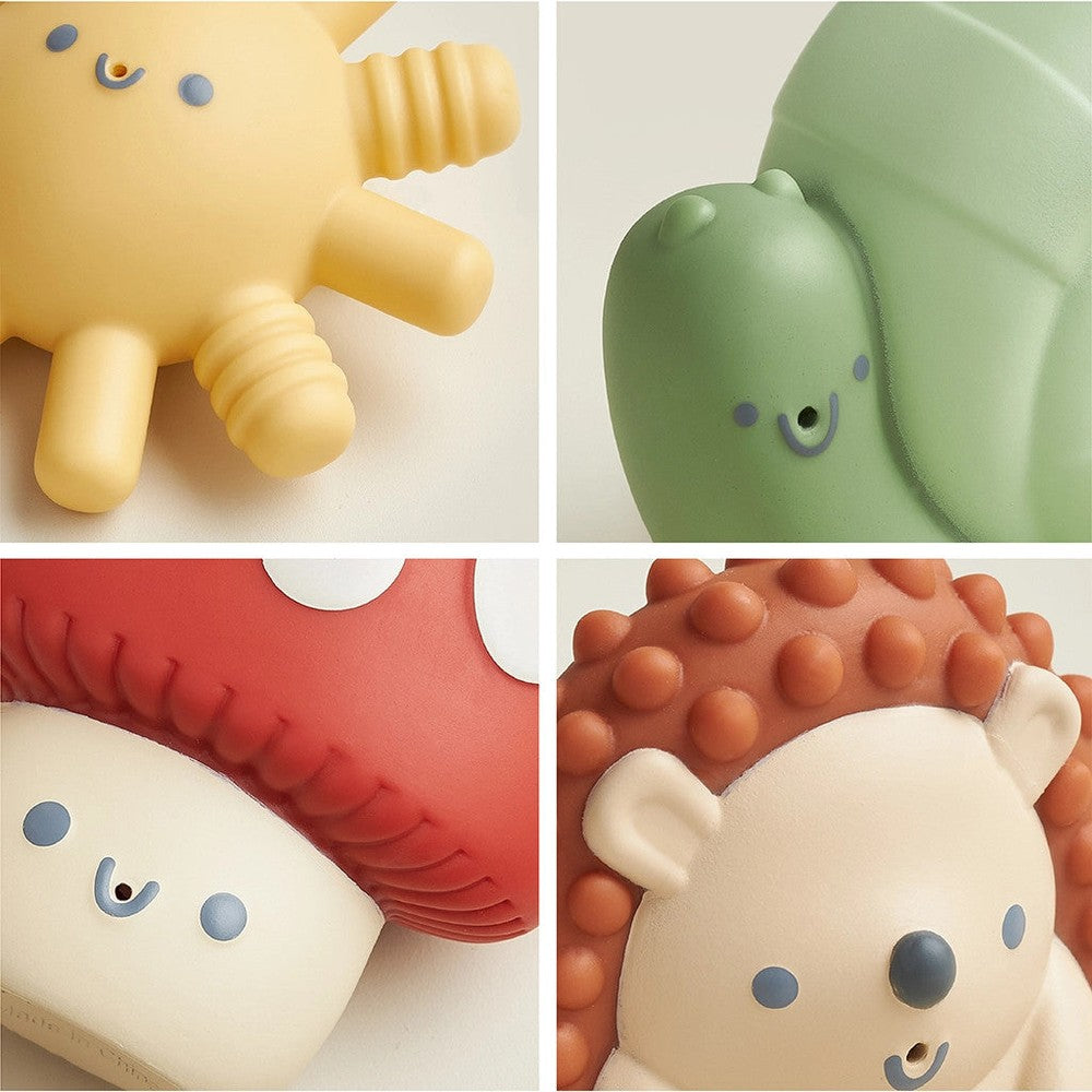 Itzy Ritzy Itzy Squirt four-pack of soft bath toys featuring smiling yellow, green, red, and orange animals
