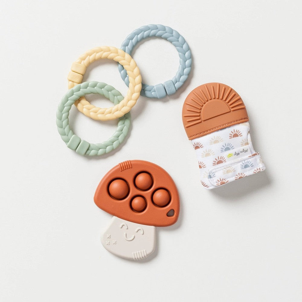 Itzy Ritzy Itzy Teether Gift Set with 3 pastel braided silicone rings and a mushroom teether with patterned sleeve