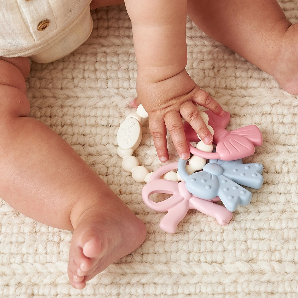 ITZY RITZY Itzy Ritzy Itzy Trio silicone teething set with butterfly, bow, and beaded ring img 3/5
