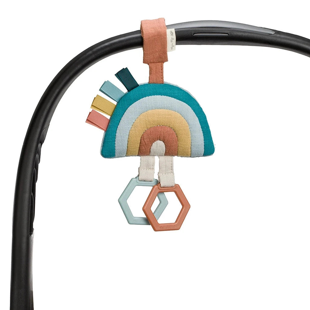 Itzy Ritzy JingleB Attachable Travel Toy rainbow fabric teether with pastel hexagon charms for strollers
