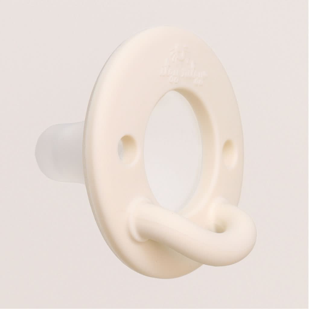 Close-up of the Itzy Ritzy Latch & Soothe one-piece pacifier handle