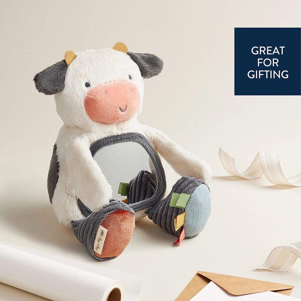 Itzy Ritzy Mirror plush cow toy with white body, gray ears, and built-in mirror