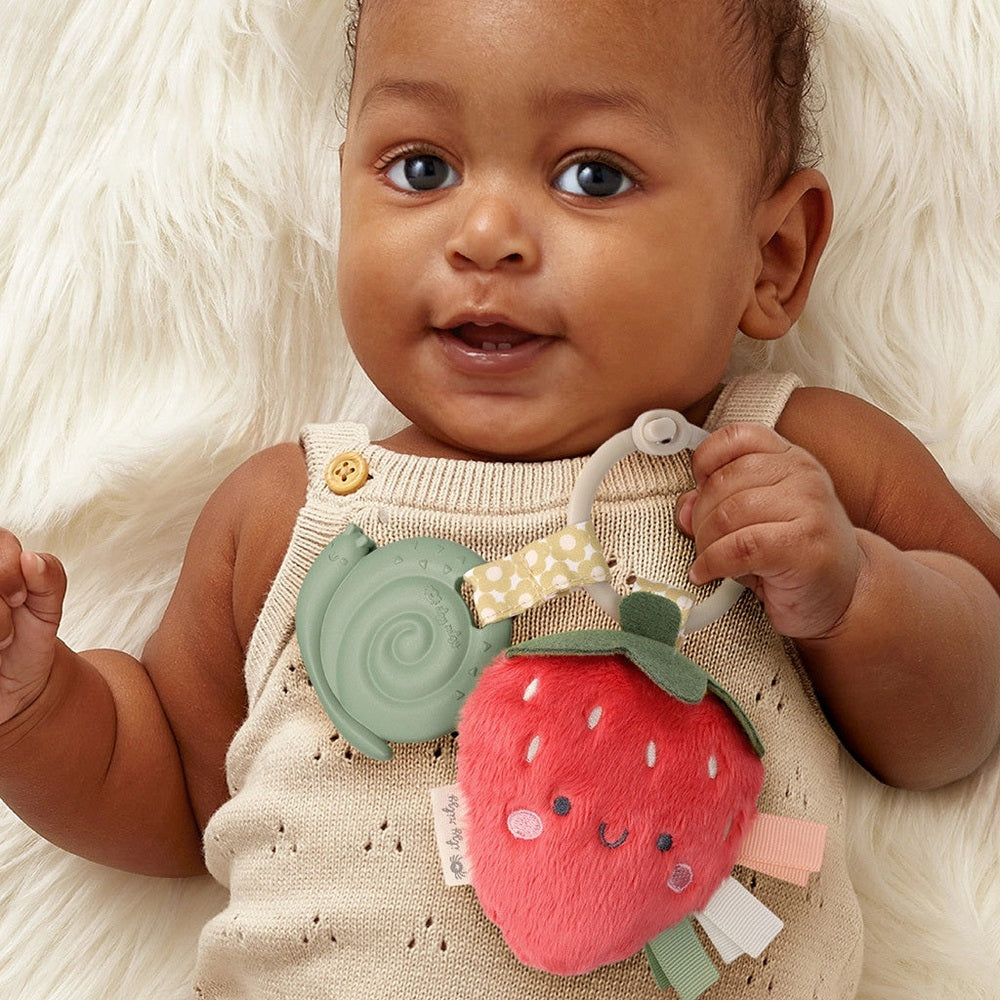 Itzy Ritzy Pal Plush and Teether strawberry plush teether with pastel ribbons