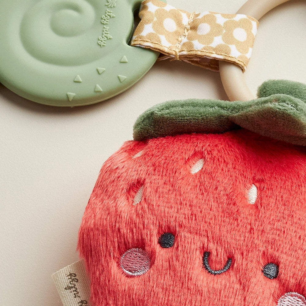 Itzy Ritzy Pal Plush and Teether strawberry stuffed toy with green teething ring