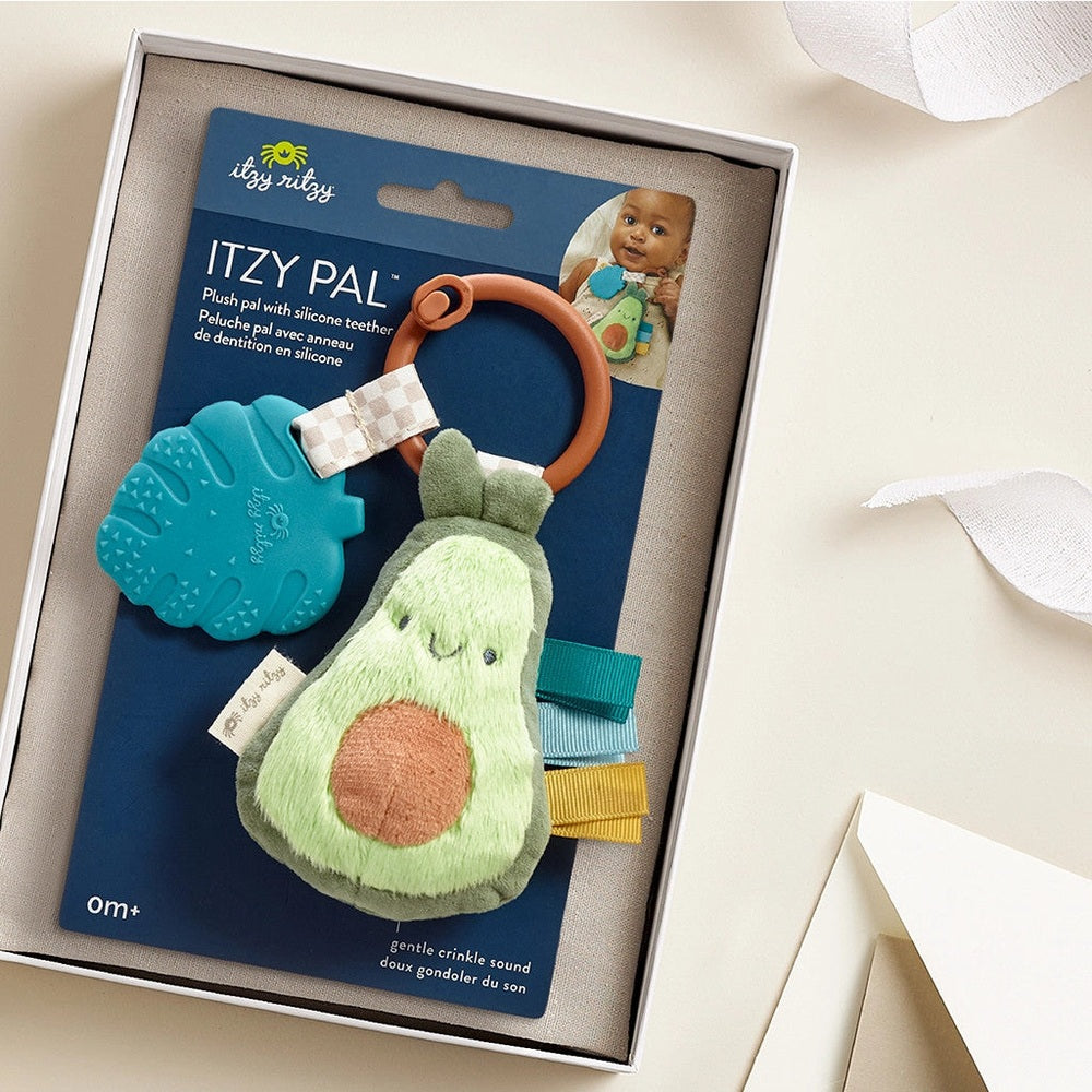 Itzy Ritzy Pal plush teether avocado character with silicone ring and colorful ribbons