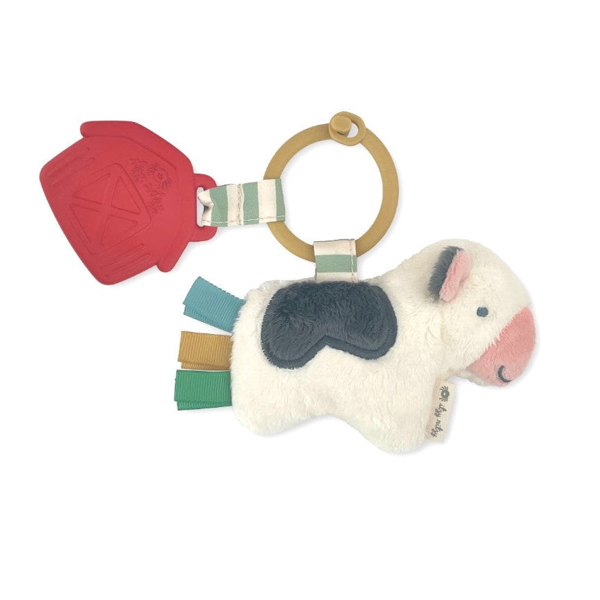 Itzy Ritzy Pal plush and teether toy: white horse with pink muzzle, black patch, ribbon tags, and wooden ring