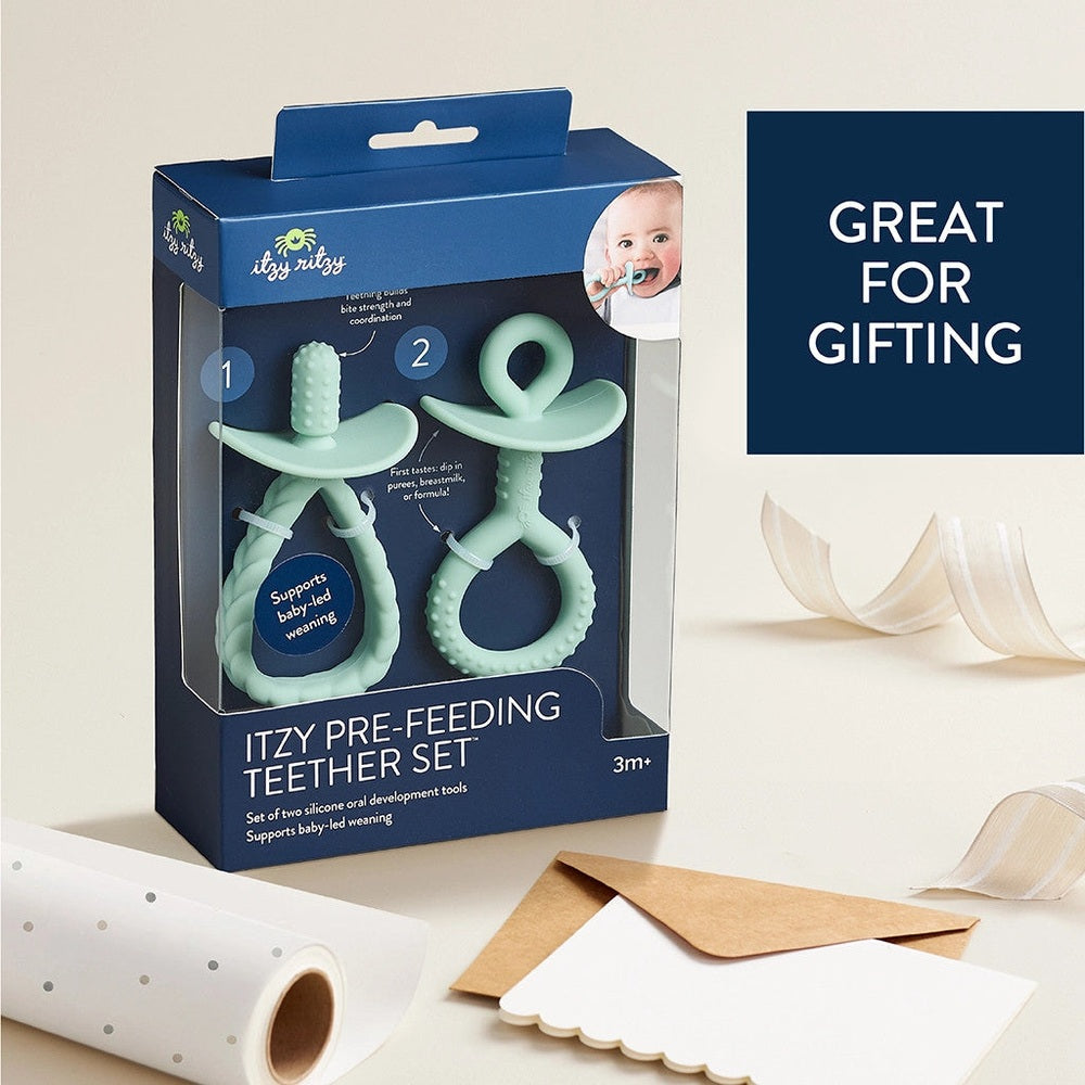 Itzy Ritzy Pre-Feeding Teether Set, mint green silicone two-piece teething toys with textured grips.