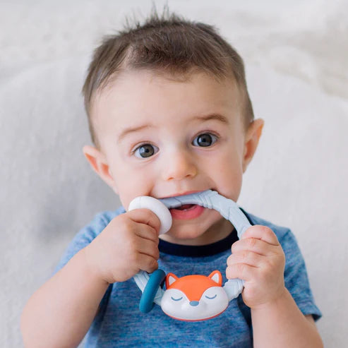 Itzy Ritzy Rattle silicone teether with blue handle and fox face design for babies