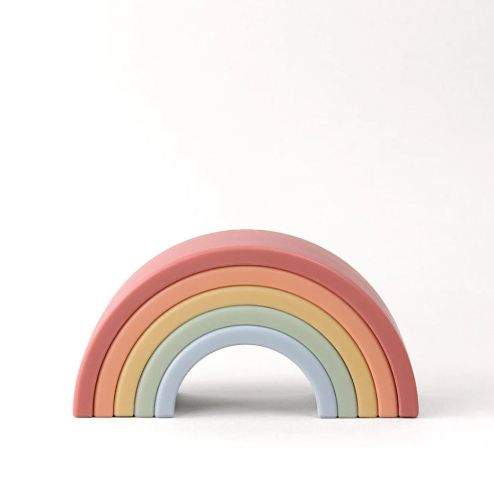 Itzy Ritzy Ritzy Rainbow stacking toy, six pastel arches in pink, coral, peach, yellow, sage, light blue.