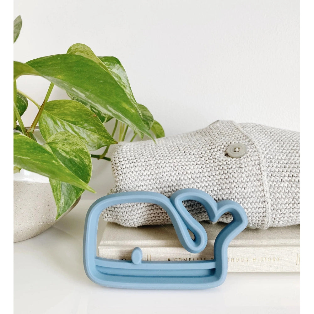 Itzy Ritzy silicone teether in light blue swan shape for babies