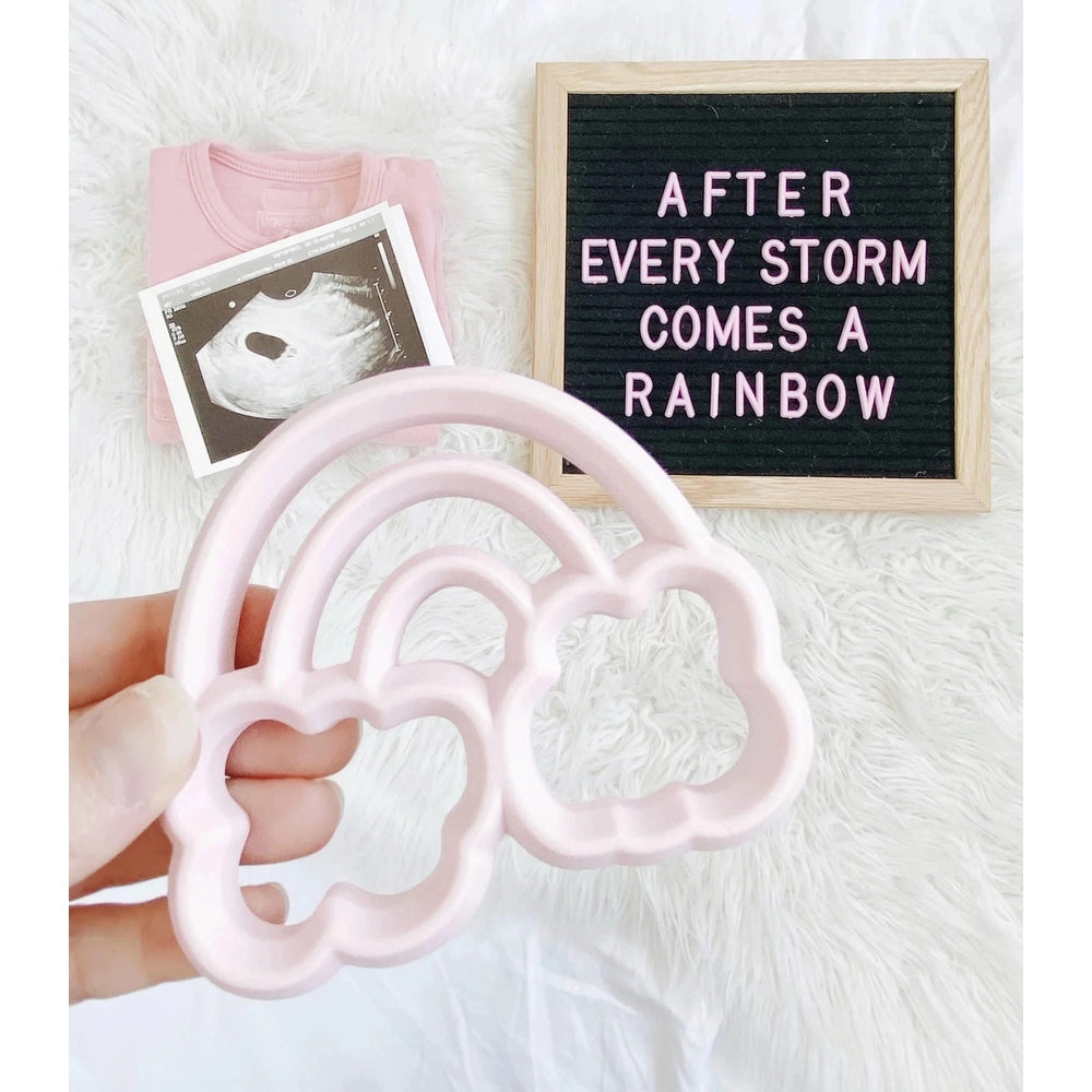 Itzy Ritzy silicone teether in soft pink cloud rainbow design for babies