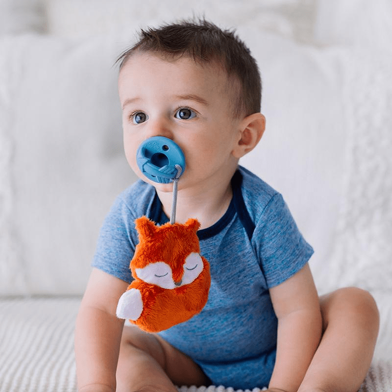 Itzy Ritzy Sweetie Pal pacifier with blue shield and orange fox plush charm
