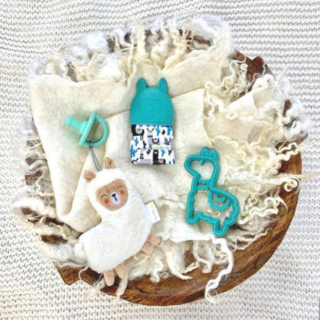 Itzy Ritzy Sweetie Pal pacifier and plush llama set with teal silicone teether shapes
