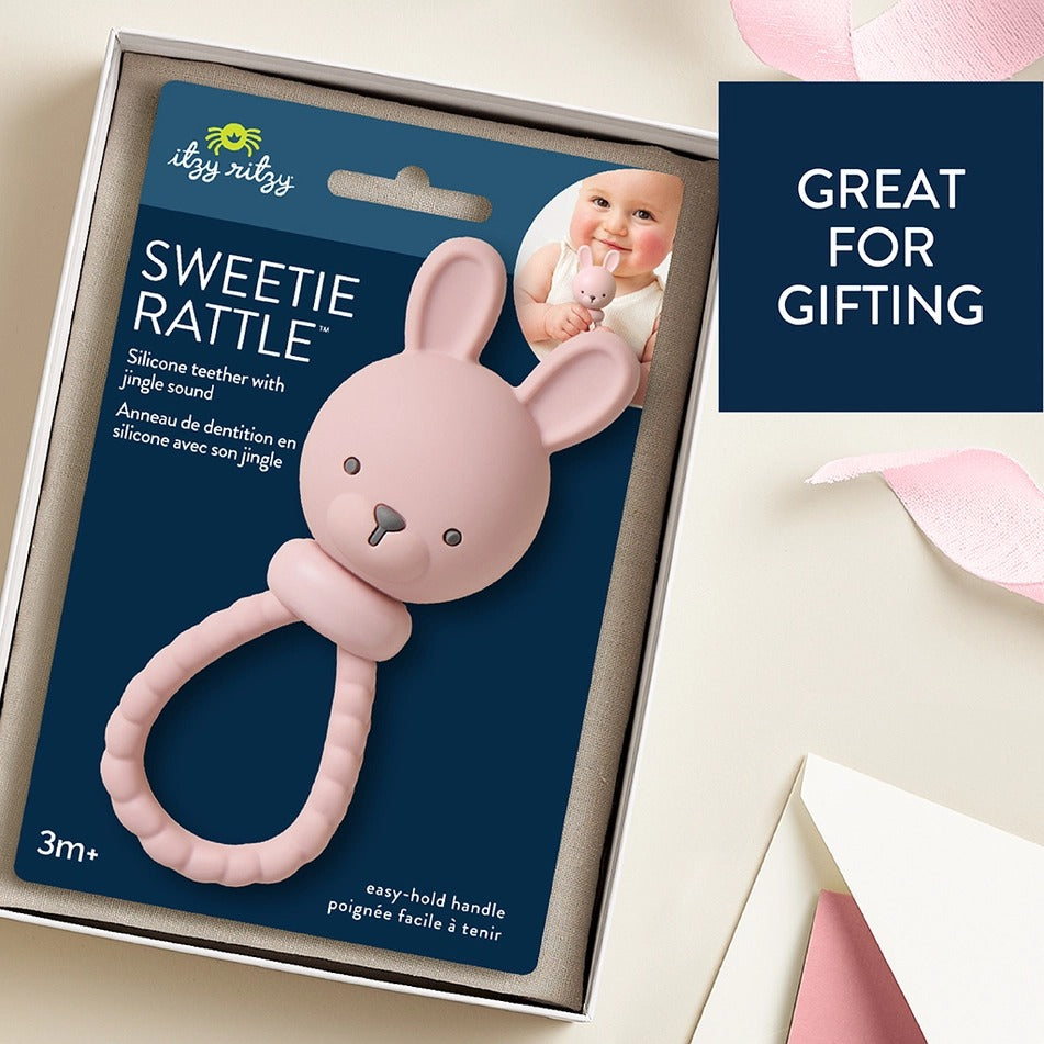 Itzy Ritzy Sweetie Rattle Pink Bunny silicone teether with jingle; baby easily grips the easy-hold handle.