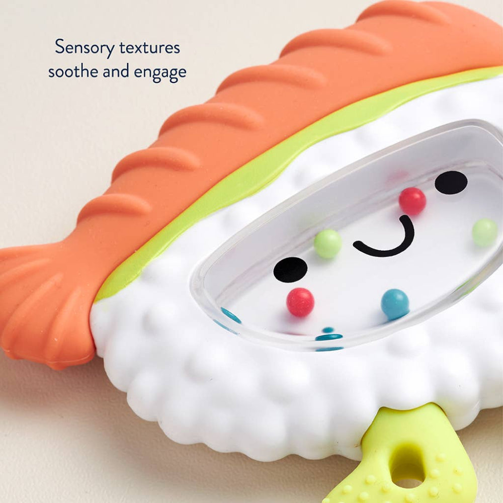 Itzy Ritzy Sweetie Shake Plus Rattle & Teether teething toy with orange textured shell and colorful beads