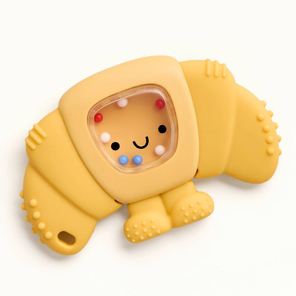 Itzy Ritzy Sweetie Shake Plus teether rattle in yellow silicone with textured grips and a smiling face