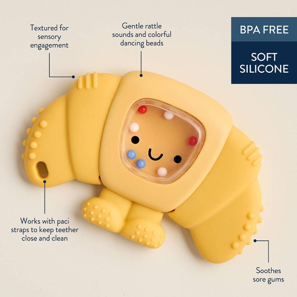 Itzy Ritzy Sweetie Shake Plus Rattle Teether in soft yellow silicone with textured surfaces