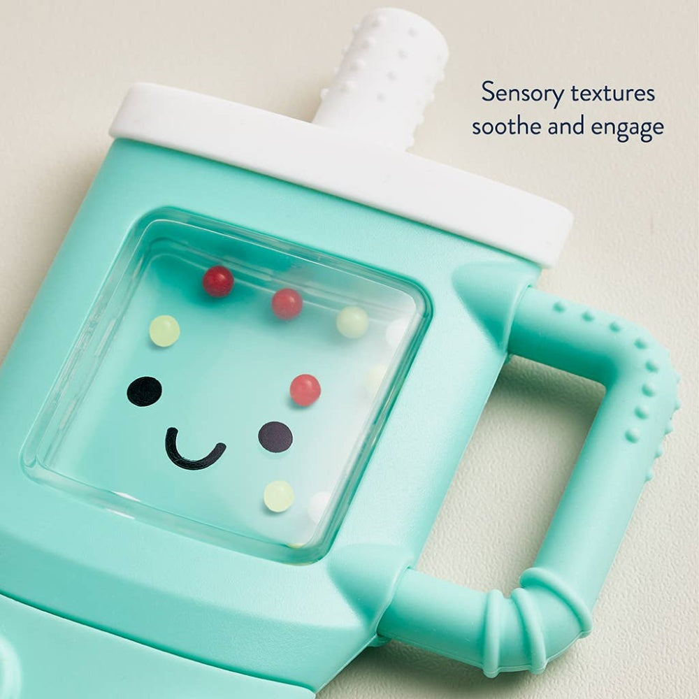 Itzy Ritzy Sweetie Shake Plus Rattle & Teether in mint teal with a smiling face window