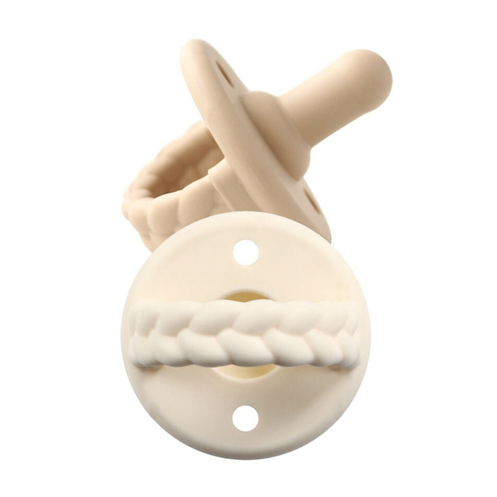 Itzy Ritzy Sweetie Soother orthodontic pacifier, ivory shield with braided ring attachment.