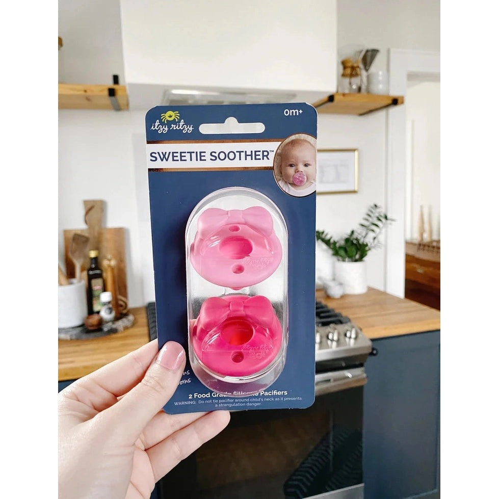 Itzy Ritzy Sweetie Soother pacifier set, pink silicone bow design, 2-pack for ages 0m+