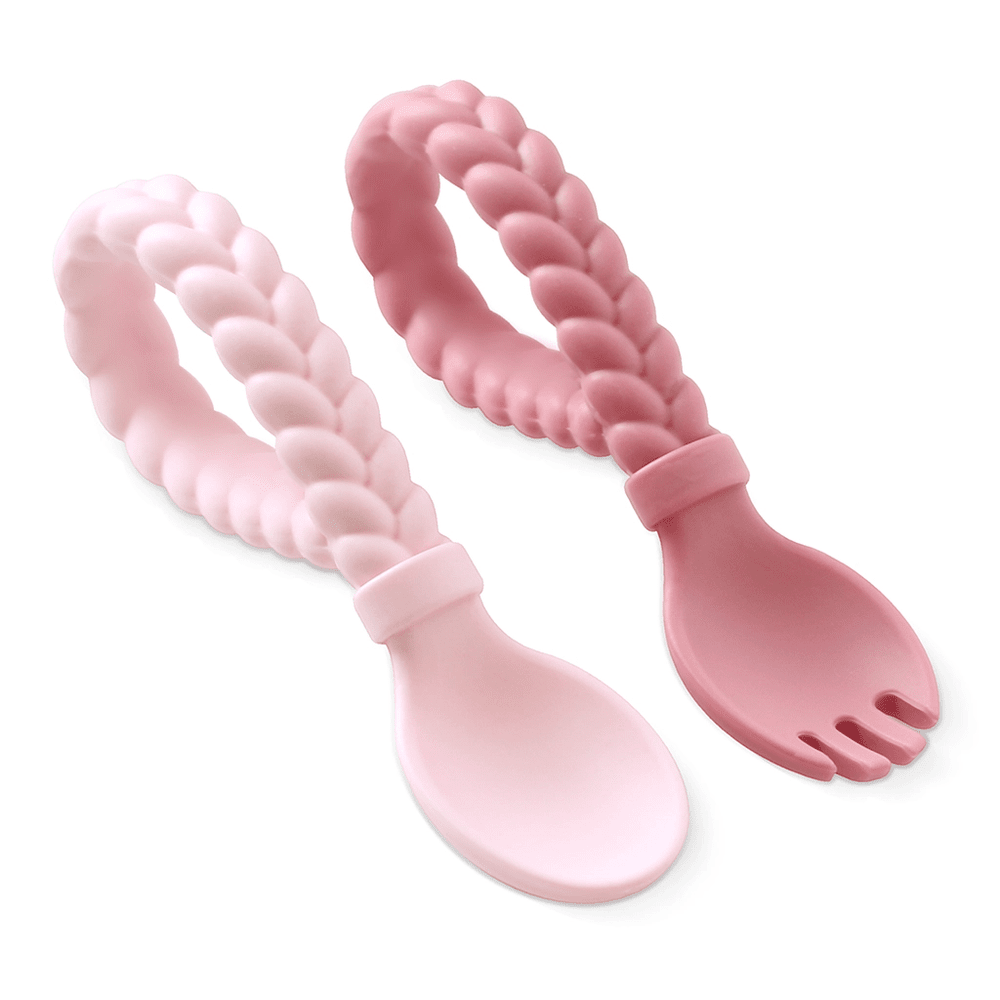 Itzy Ritzy Sweetie Spoon & Fork Set: two pastel pink silicone utensils with braided handles ready for mealtime.