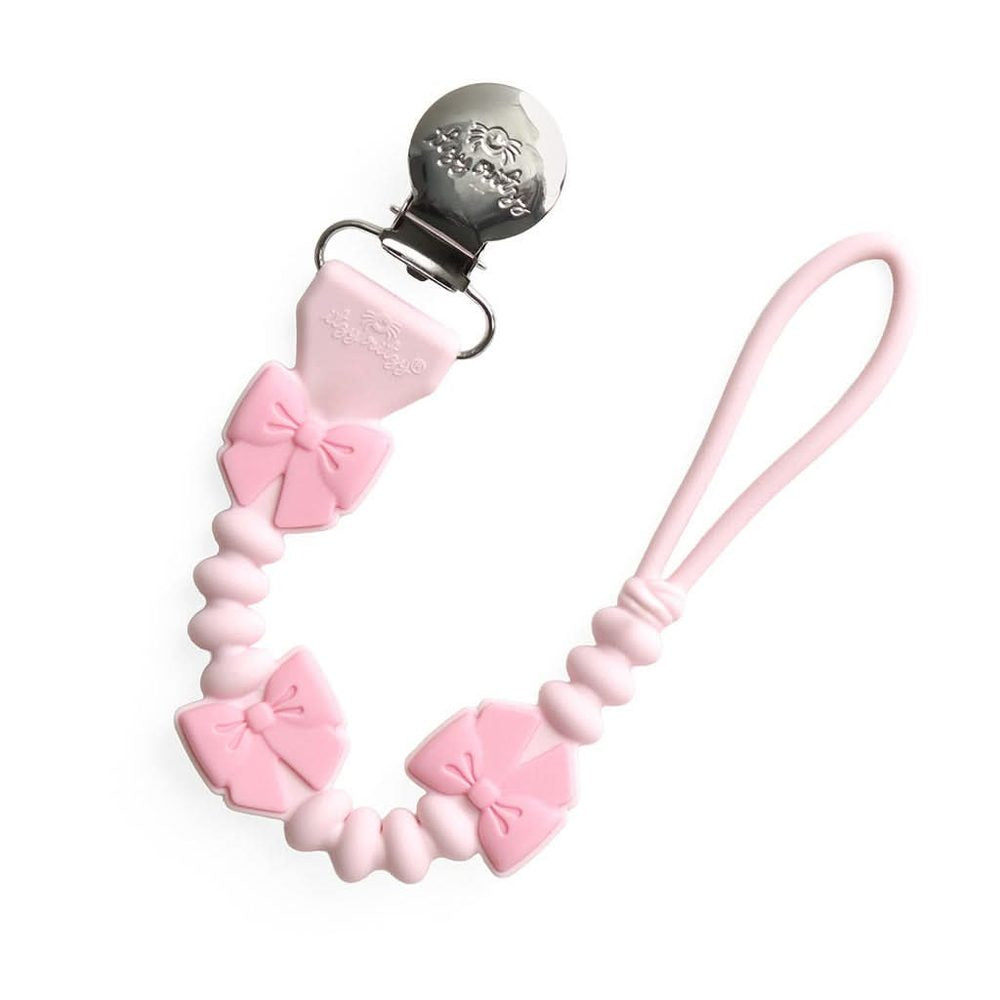 Itzy Ritzy Sweetie Strap Plus Bow pink silicone pacifier clip front view