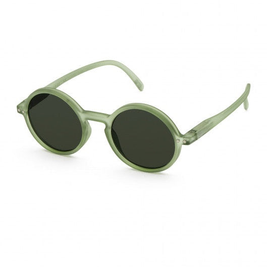 IZIPIZI Sun Junior Peppermint sunglasses for kids, round translucent green frames with dark lenses.