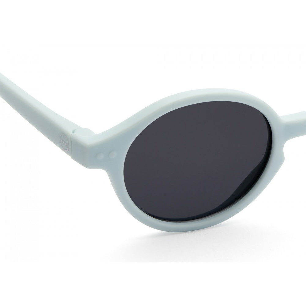 Izipizi Junior Sweet Blue sunglasses with round light-blue frame and dark lenses.