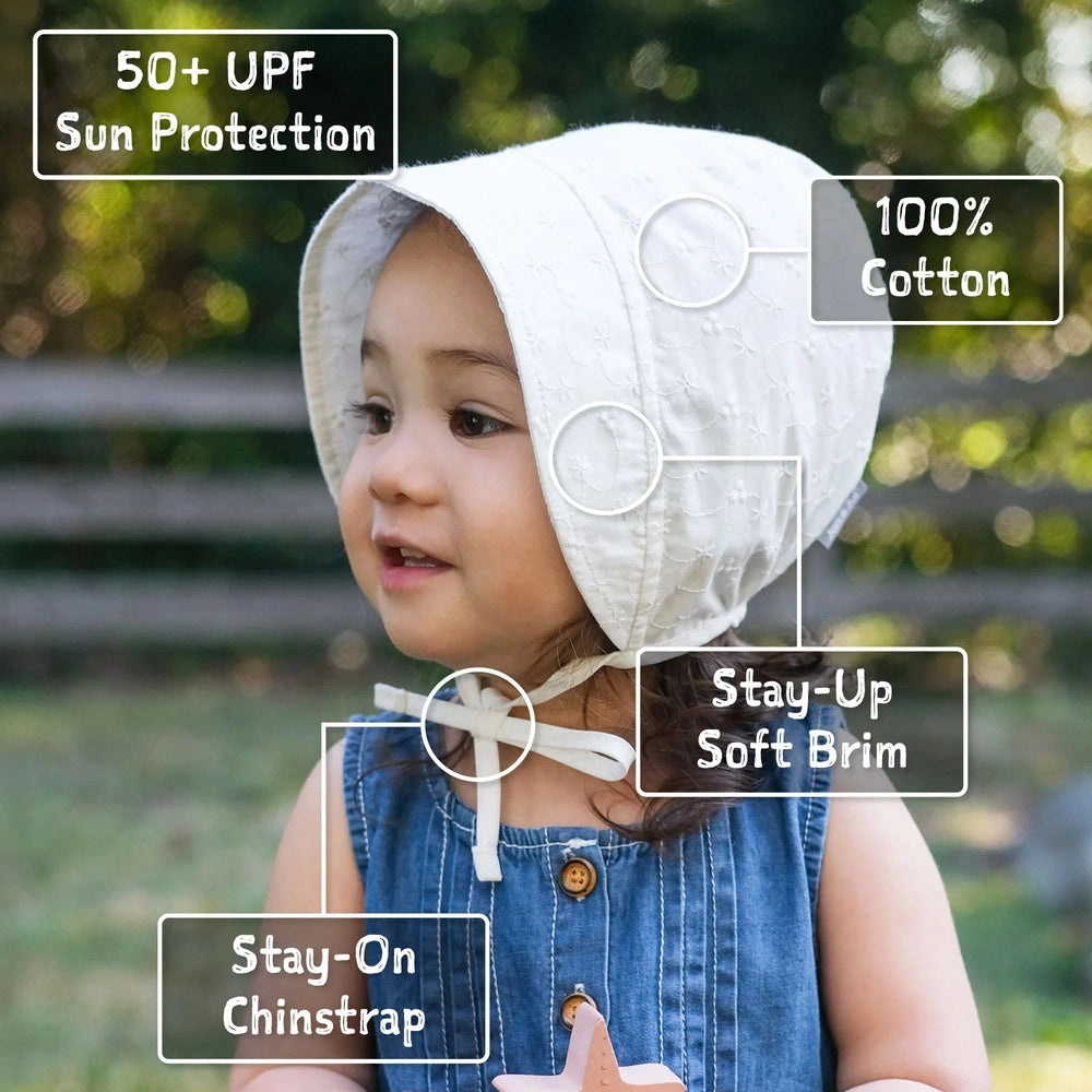 JAN & JUL Jan & Jul Baby Bonnet - White Eyelet Embroidered eyelet pattern with tie chinstrap and stay-up brim img 3/5