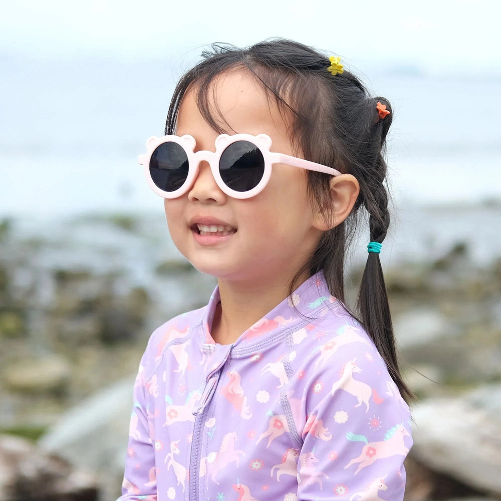 JAN & JUL Jan & Jul Bear Sunglasses W/Black Lens - Soft Pink round children sunglasses shown in product color from image 2 of 7 with flexibl