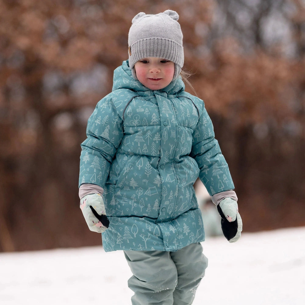 JAN & JUL Kids Bear Knit Hat in soft grey with bear ears, on a toddler walking in the snow.