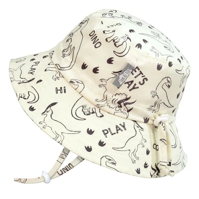 Jan & Jul Kids Cotton Bucket Hat Dino Play, cream with dinosaur print and adjustable chin strap shown