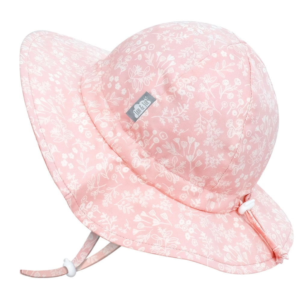 Jan & Jul Kids Cotton Floppy Hat Pink Prairie with adjustable chin strap securing under the chin.
