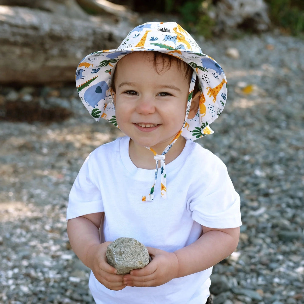 Jan & Jul Kids Cotton Floppy Hat Safari in white with colorful jungle animal print and chin strap