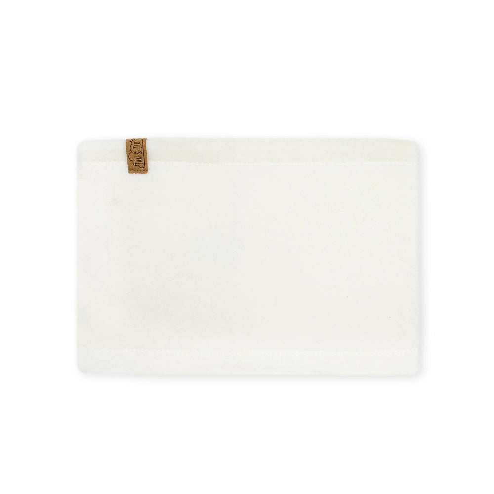 JAN & JUL Kids Fleece Neck Warmer in white fleece, laid flat with brand tag visible.