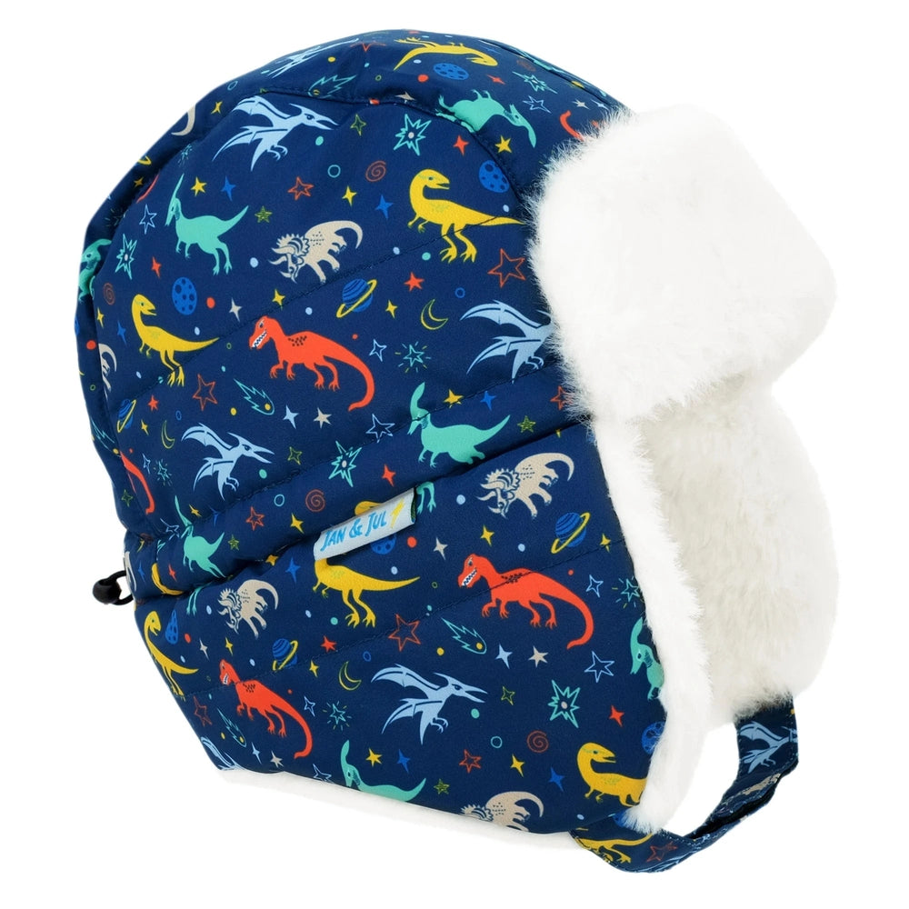 Jan & Jul Kids Insulated Winter Hats Space Dinos navy hat with white faux-shearling ear flaps, featuring dinos and planets.