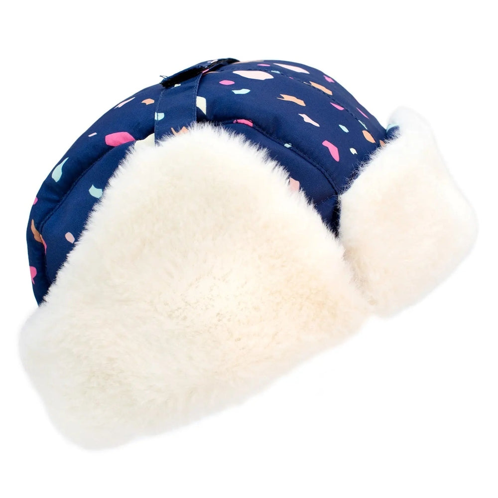 Jan & Jul Kids Insulated Winter Hat Terrazzo with navy shell and oversized white faux-fur ear flaps