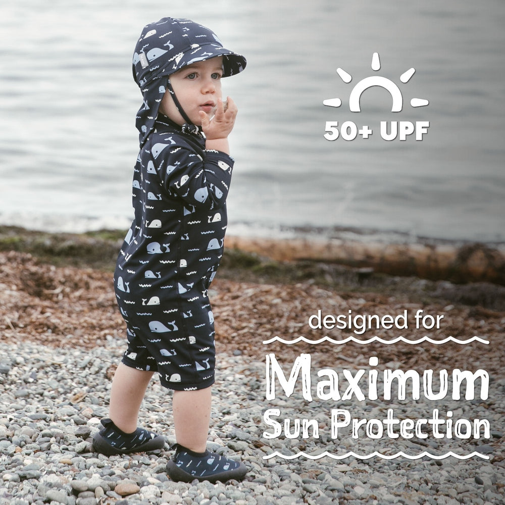 JAN & JUL Jan & Jul Kids One Piece UV Sun Suit Navy Whale Tales with matching chin-strap hat and coordinating water shoes img 7/8