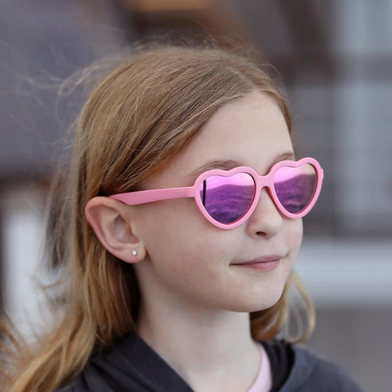 Jan & Jul Kids Polarized Heart Sunglasses, peachy pink frame with purple mirrored lenses.